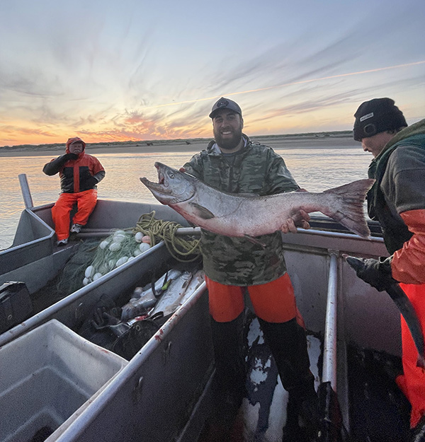 Crew member holding Salmon